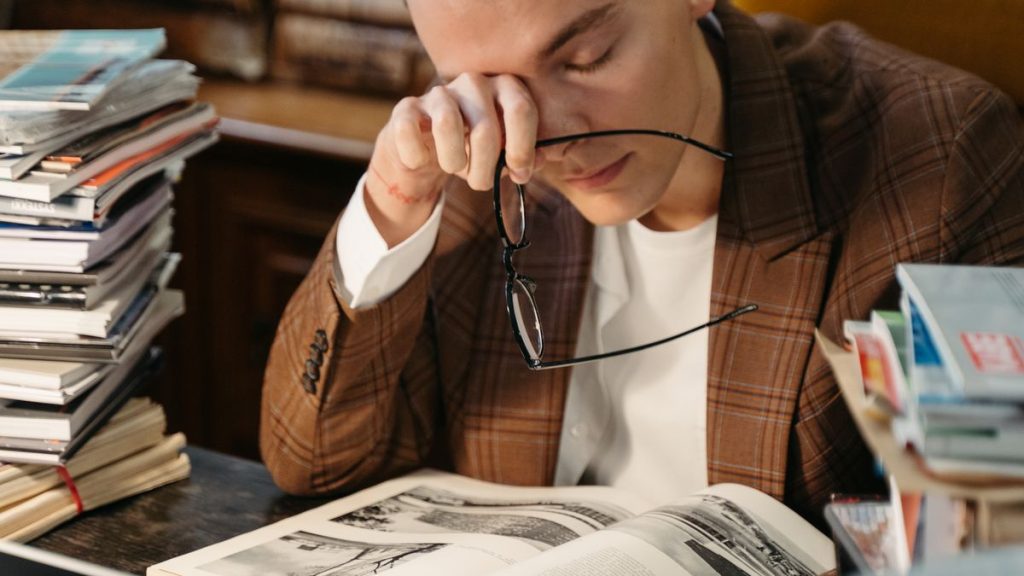 Tired person at a laptop with eye strain