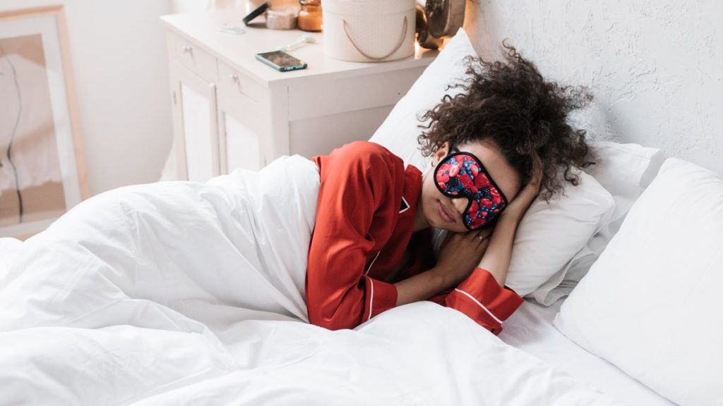 Woman relaxing with an eye mask