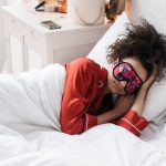 Woman relaxing with an eye mask